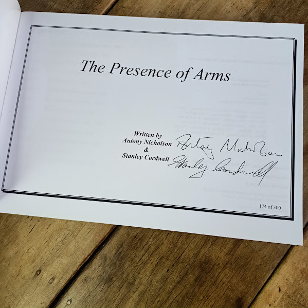 Signature page from The Presence of Arms