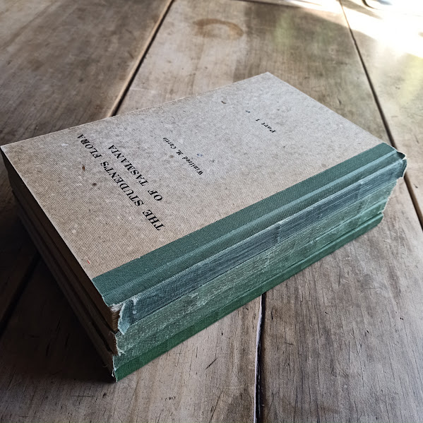 Stack of Student Flora of Tasmania books showing worn spines
